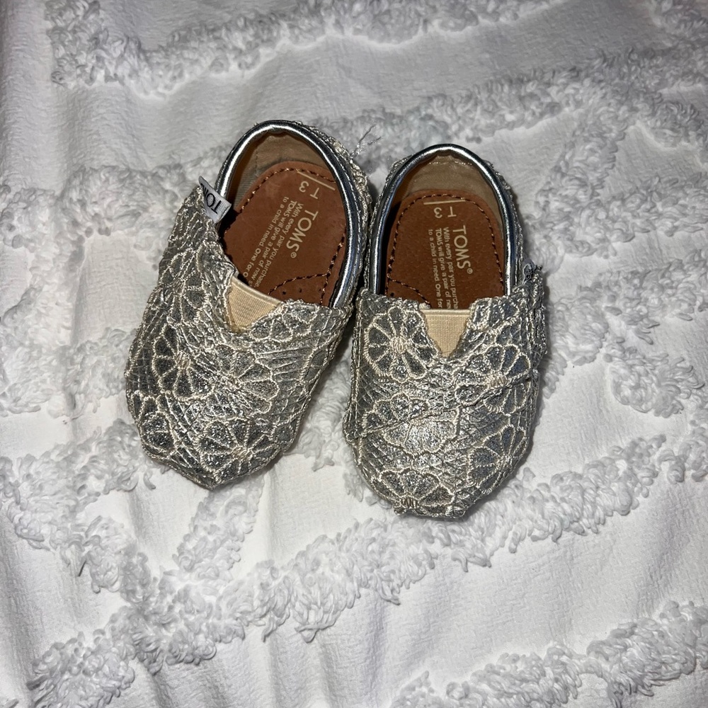 TOMS Tiny Moccasins in Shimmering Silver